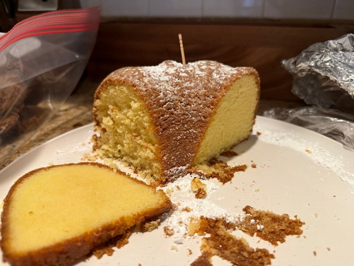 A portion of the Philly Fluff Bundt cake, one side sliced the day of baking, the other sliced smooth the following day.