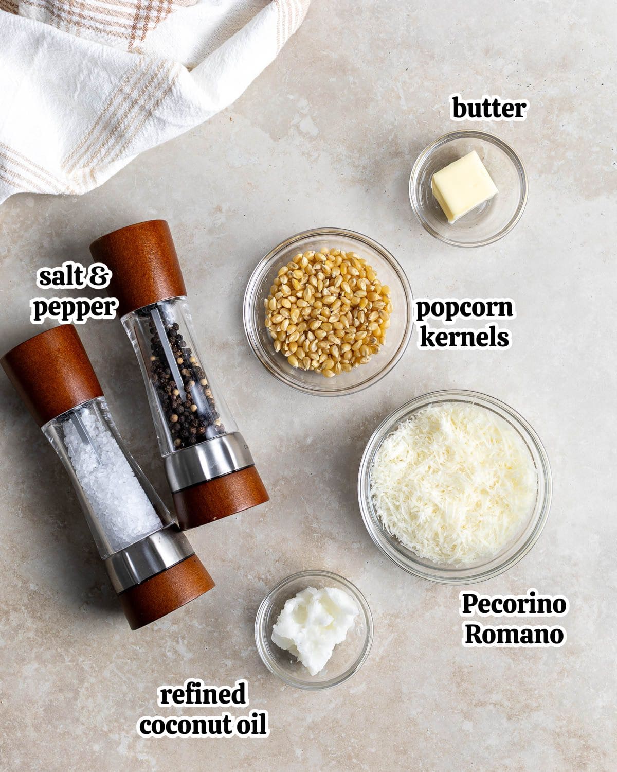 Text-labeled cacio e pepe popcorn ingredients in separate containers.