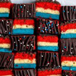 Red white and blue rainbow cookies in an alternating side-profile and top pattern.