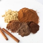 Pie spices in piles next to one another on a plate.