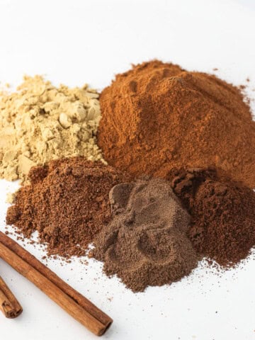 Pie spices in piles next to one another on a plate.