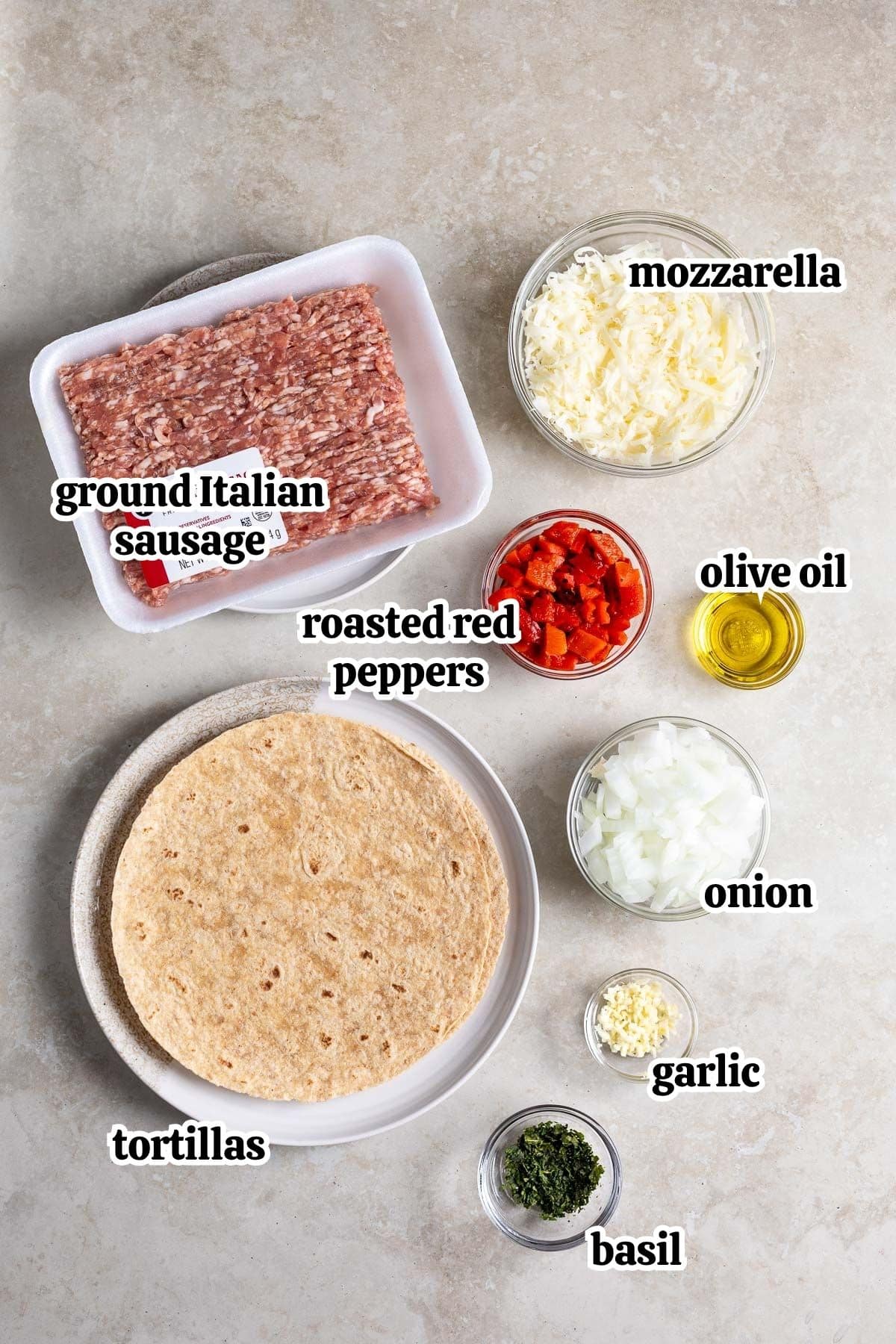 Text-labeled quesadillas ingredients in separate containers.