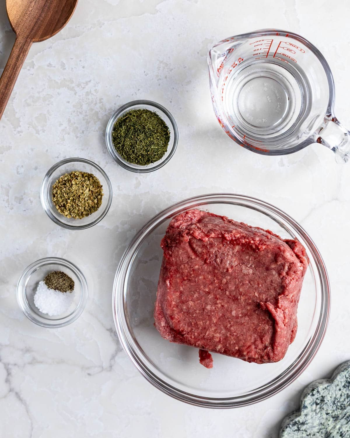 Ingredients to make Mediterranean spiced ground beef in separate container.