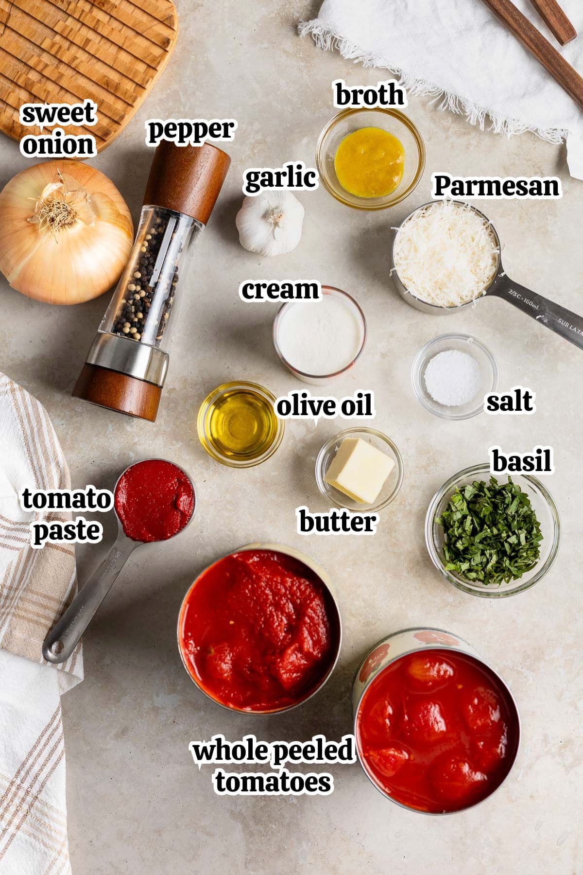 Text-labeled tomato soup ingredients in separate containers.