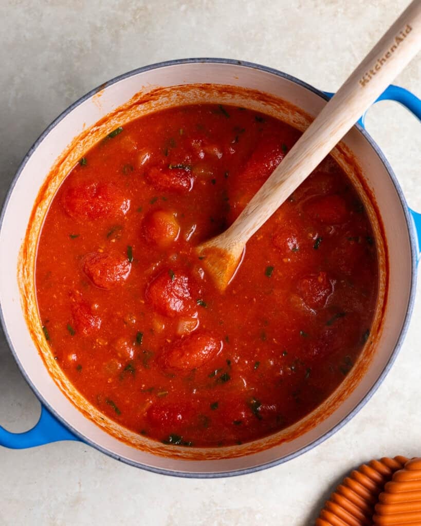 Tomato soup in the pot after simmering and before immersion blending.