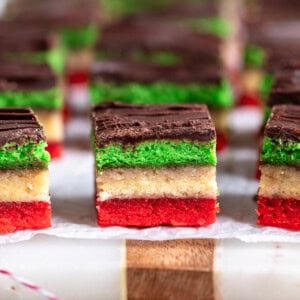 Sliced Italian rainbow cookies on a board.